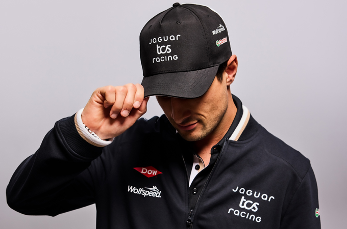 Mitch Evans #9 wearing Jaguar TCS Racing team cap and zip-through jumper from season 11 collection.